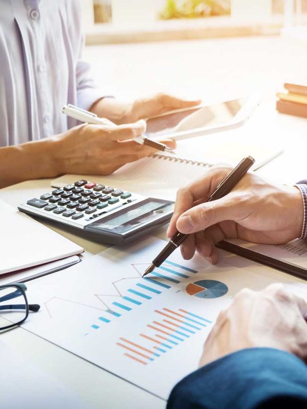 business man financial inspector and secretary making report, calculating or checking balance. Internal Revenue Service inspector checking document. Audit concept